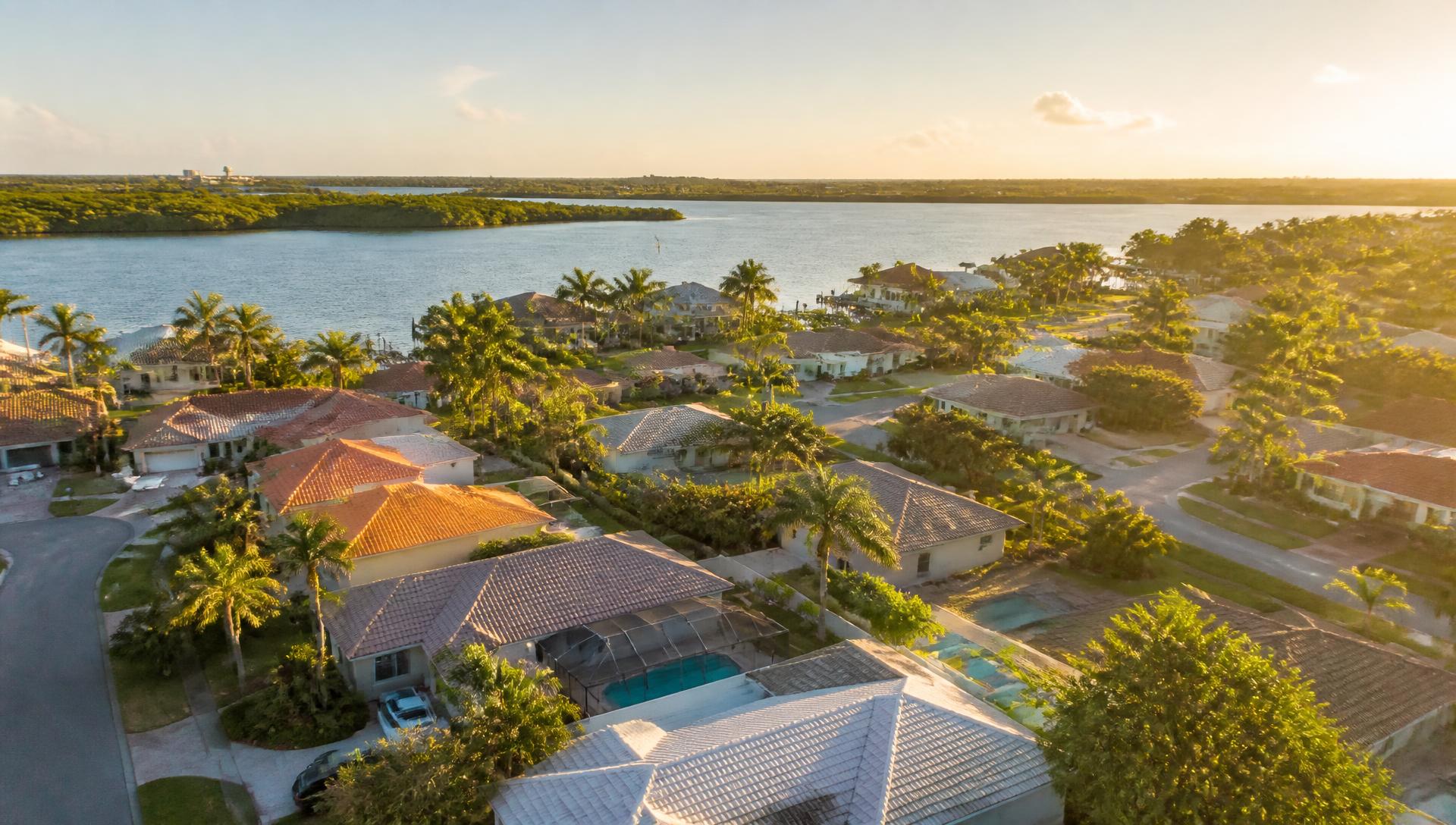 Aerial view of a waterfront Dunedin, Florida neighborhood at golden hour